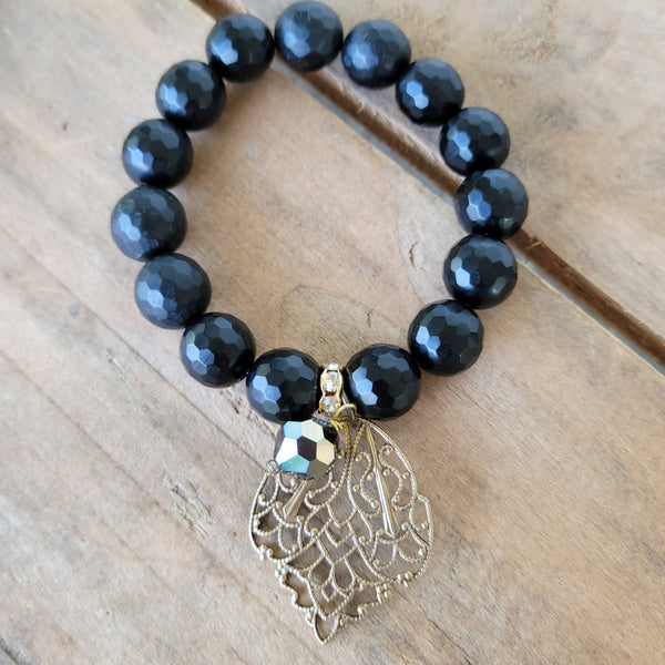 12mm matte black agate beads w/ vintage brass & bead charms stretch bracelet