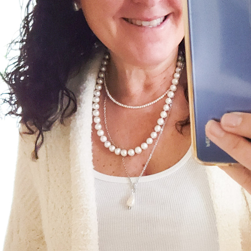 pearl necklaces layered on model