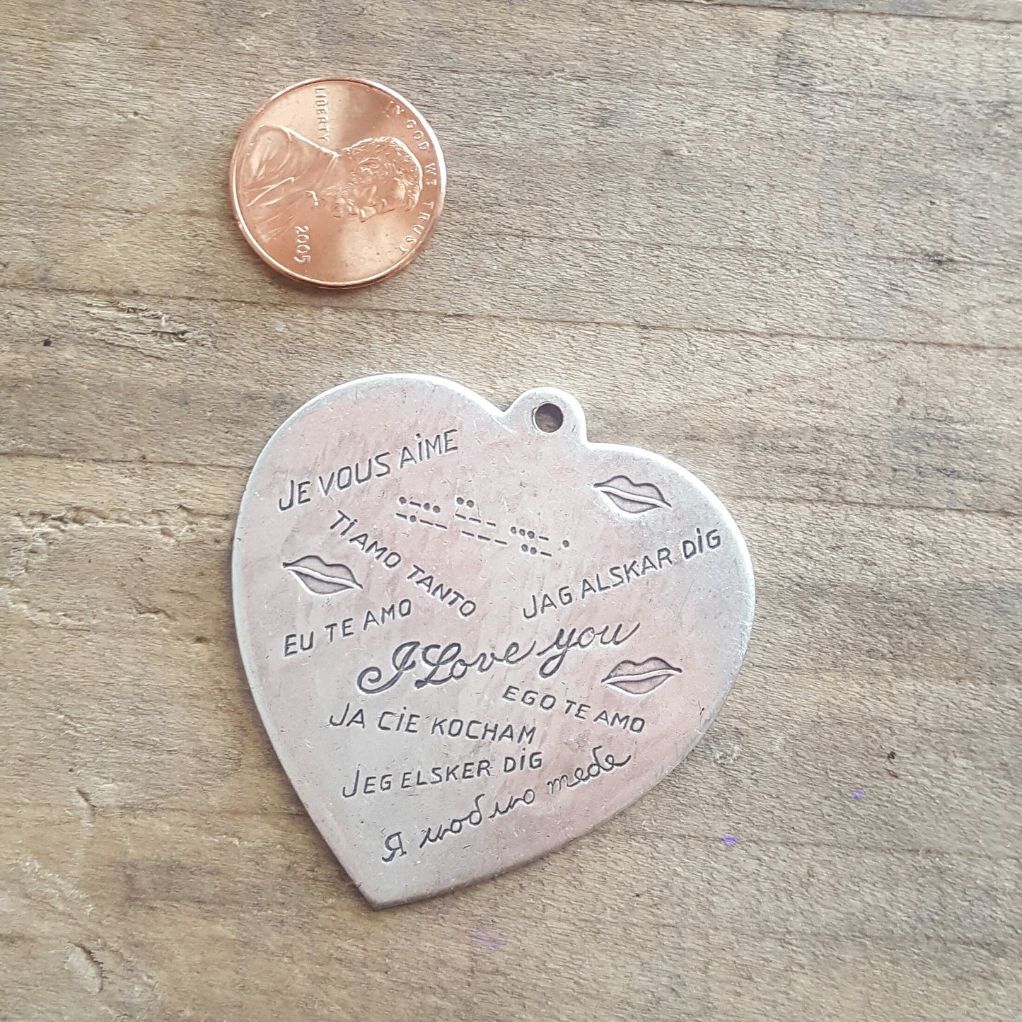 44mm pewter heart charm stamped with I love you in many languages including morse code
