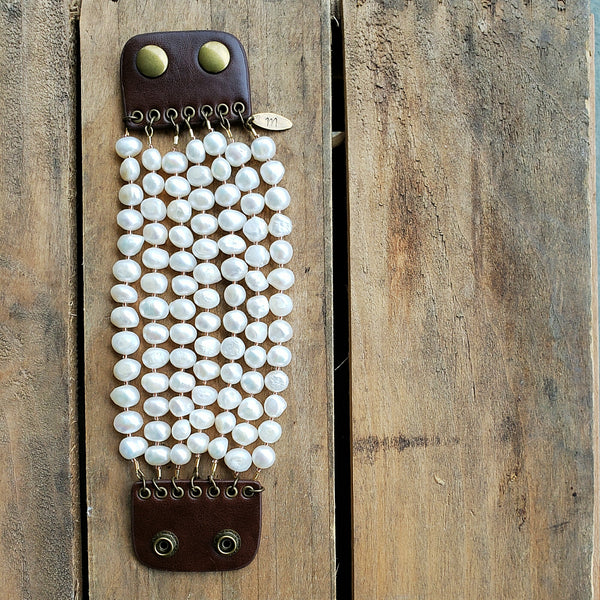 brown leather and brass snap closure with 7 strands of 11mm unique freshwater pearls and gold foil seed crystals bracelet