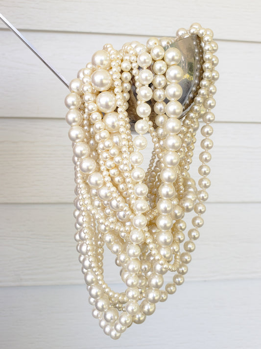 pearl necklaces in a ladle