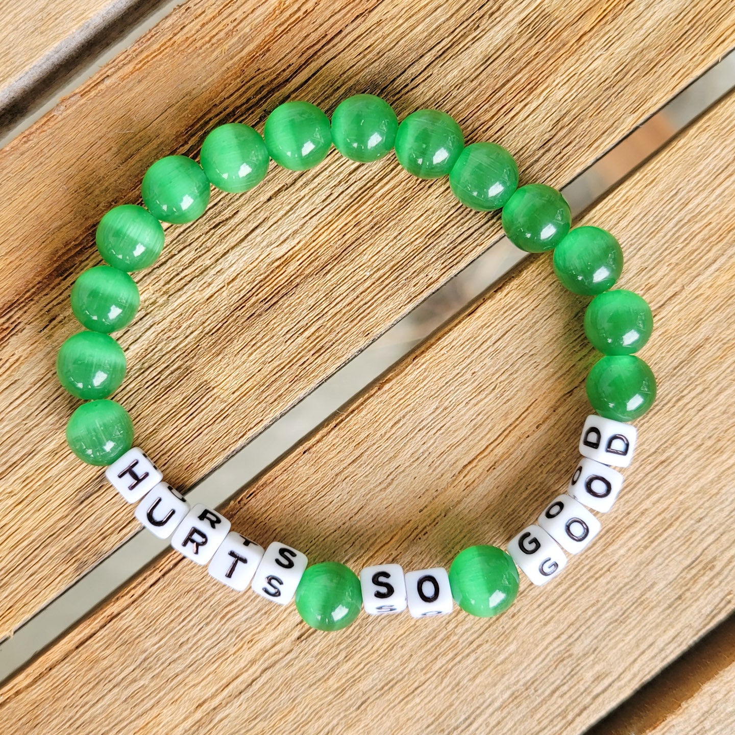 Dk. Green Eagles HURTS SO GOOD bead stretch bracelet 8mm 10mm