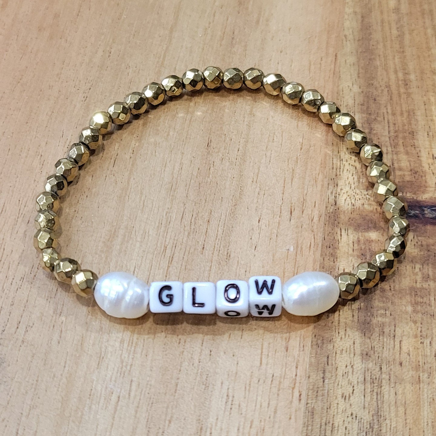 gold hematite, freshwater pearls and mini letter GLOW beads stretch bracelets