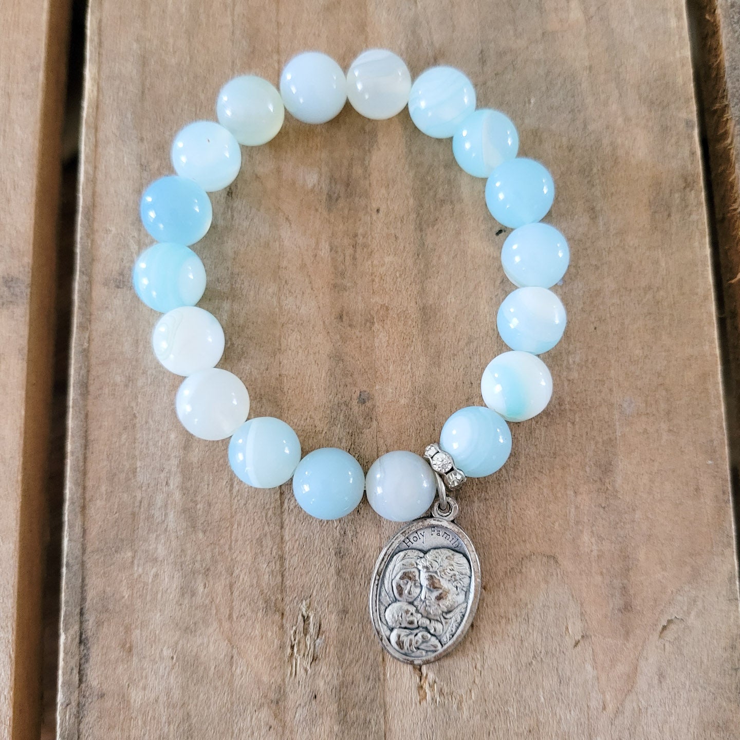 10mm sky blue agate beads Holy Family 1" medal stretch bracelet