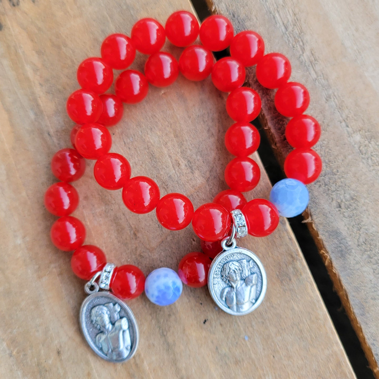 10mm red agate smooth beads 1 blue prayer bead St. Sebastian religious medal stretch bracelet