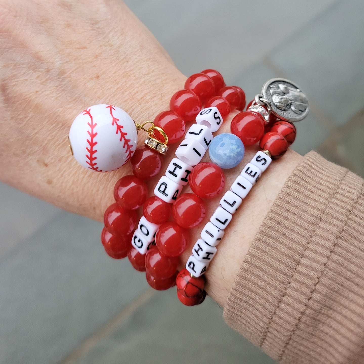 Stack of PHILLIES bead stretch bracelets, baseball charm St. Sebastian medal