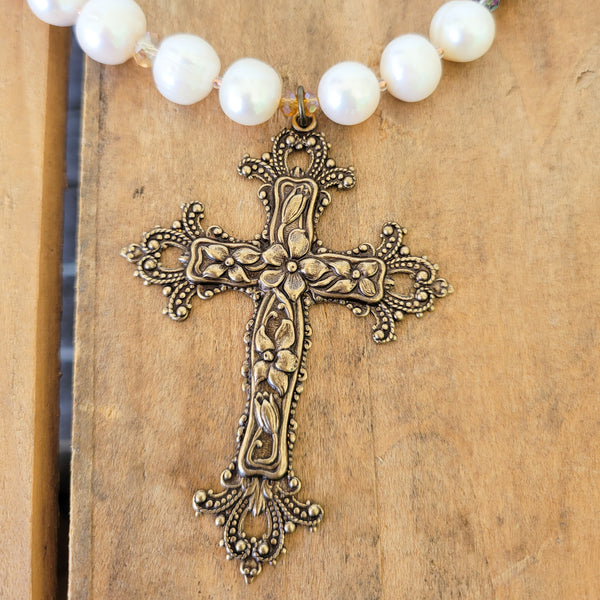 Large vintage brass cross pendant close up