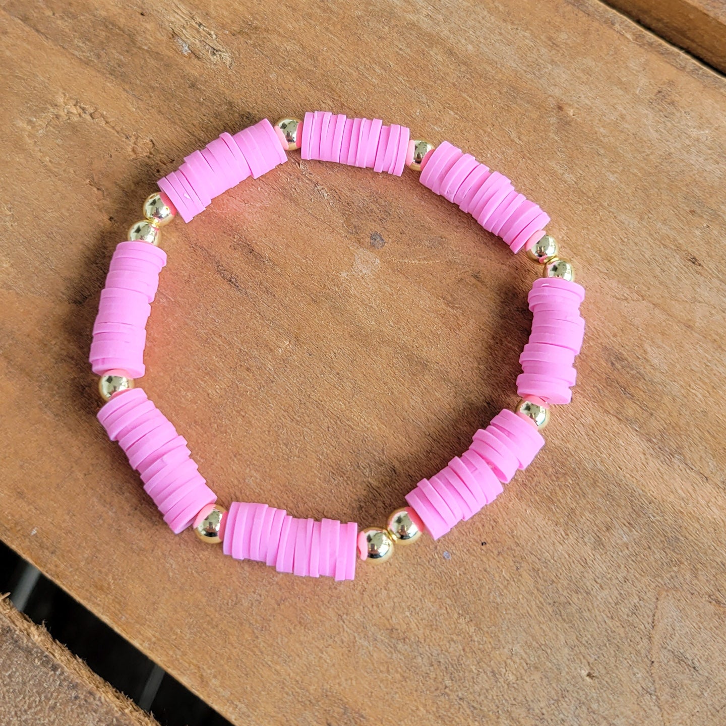 bubblegum pink rubber discs w 14kt gold coated beads stretch bracelet