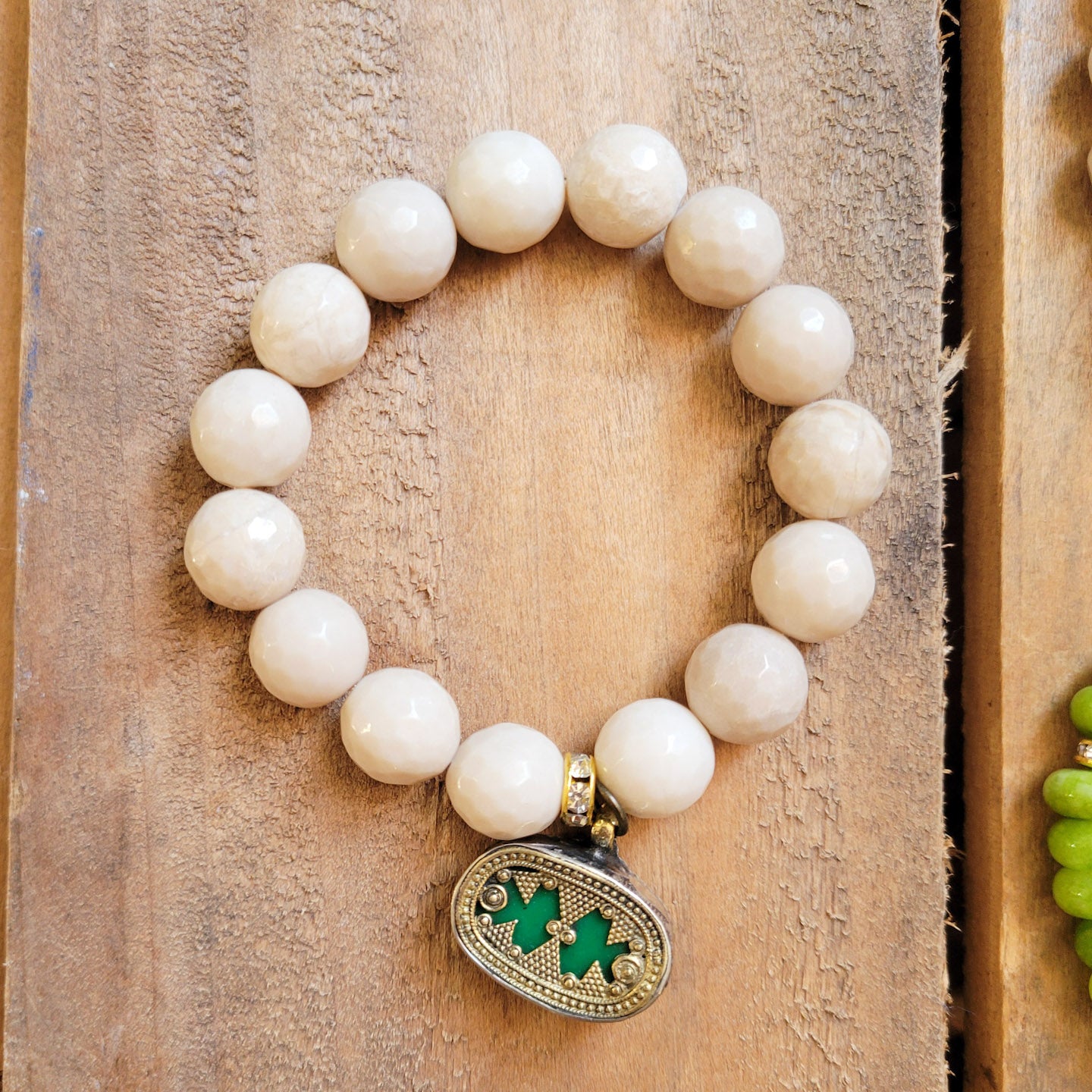 12mm cream agate w vintage brass and green charm stretch bracelet