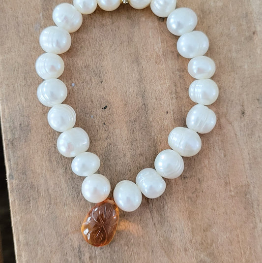 Pearls and carved honey quartz protection bracelet