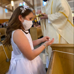{ FIRST HOLY COMMUNION }