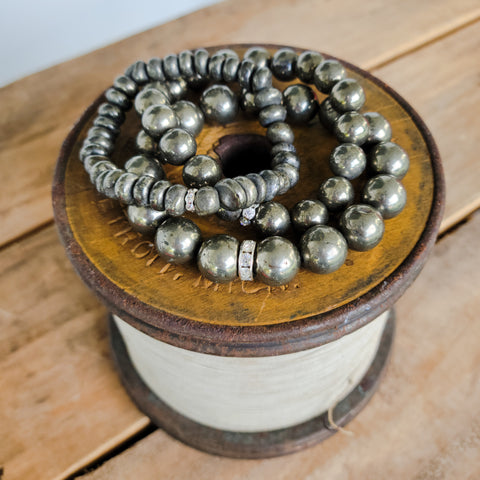 Pyrite gemstone pile of stretch bracelets