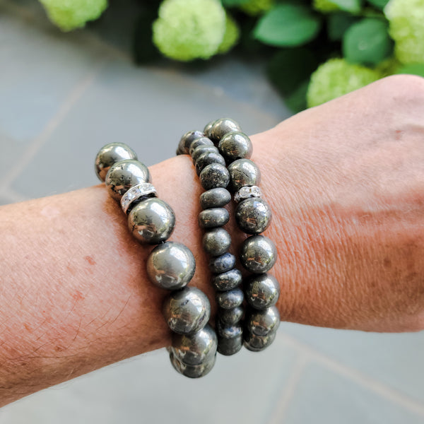 Pyrite gemstone of stretch bracelets on my wrist