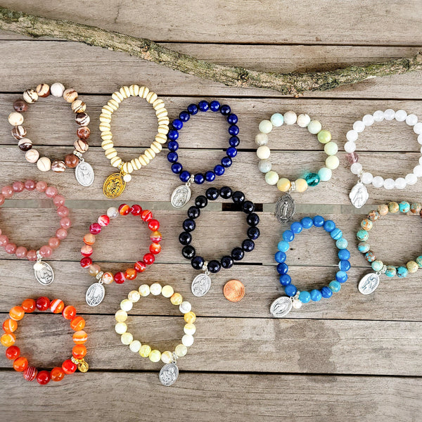 Collection of religious Medal stretch bracelets family photo